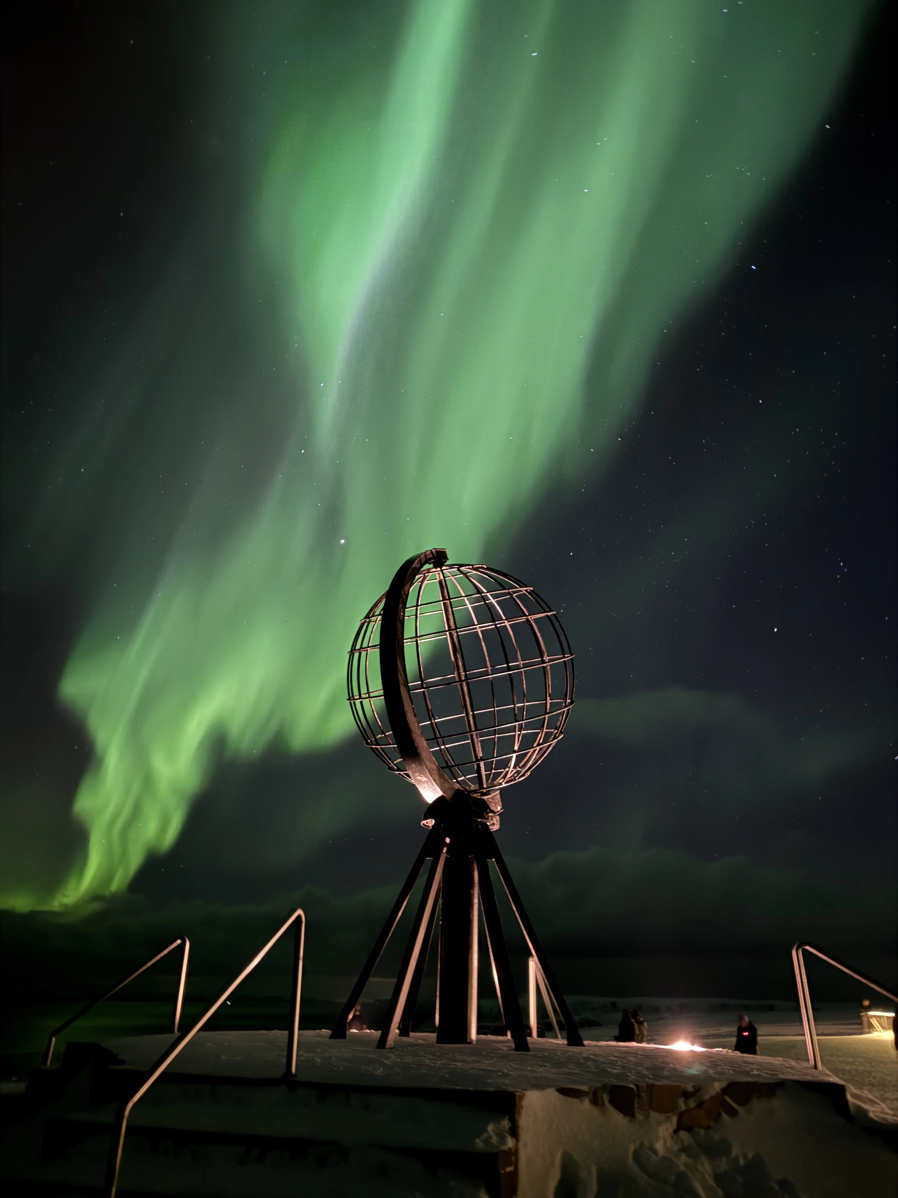 North Cape globe under northern lights in Norway